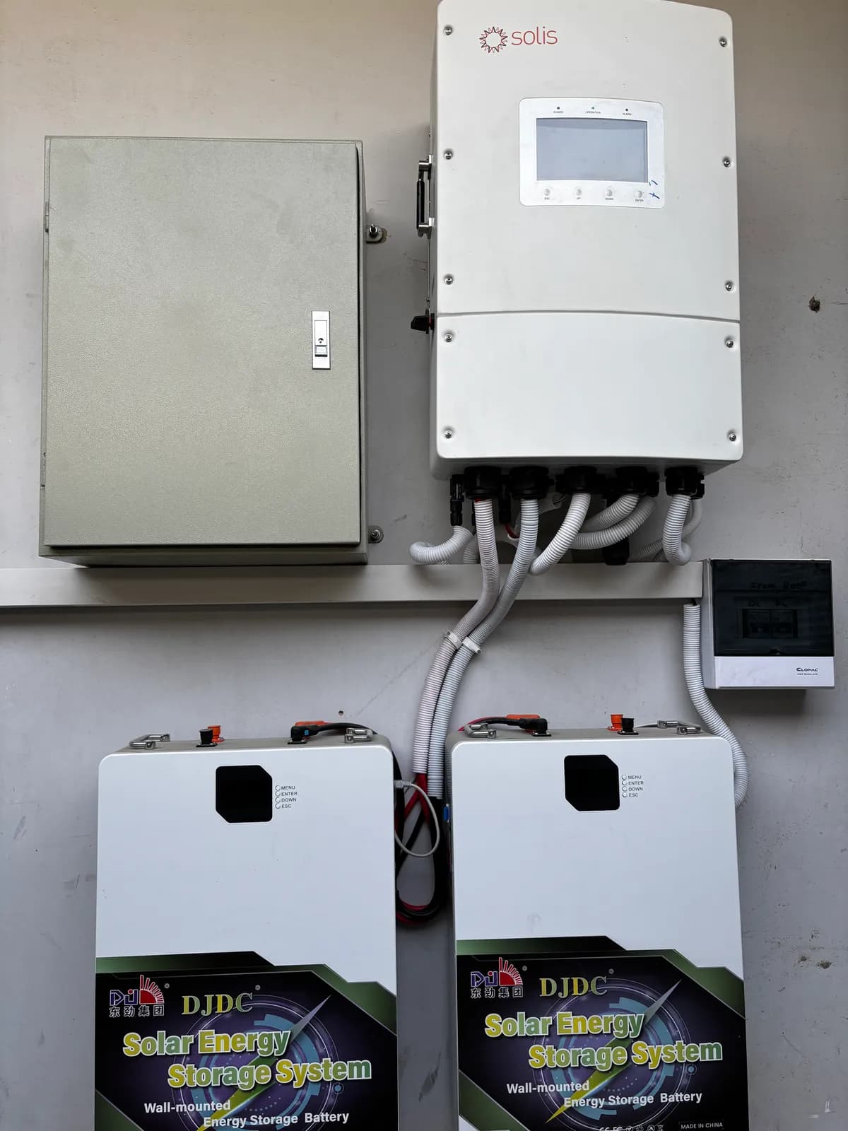 Lithium battery bank wired to a hybrid solar inverter by APC Solar in Karachi