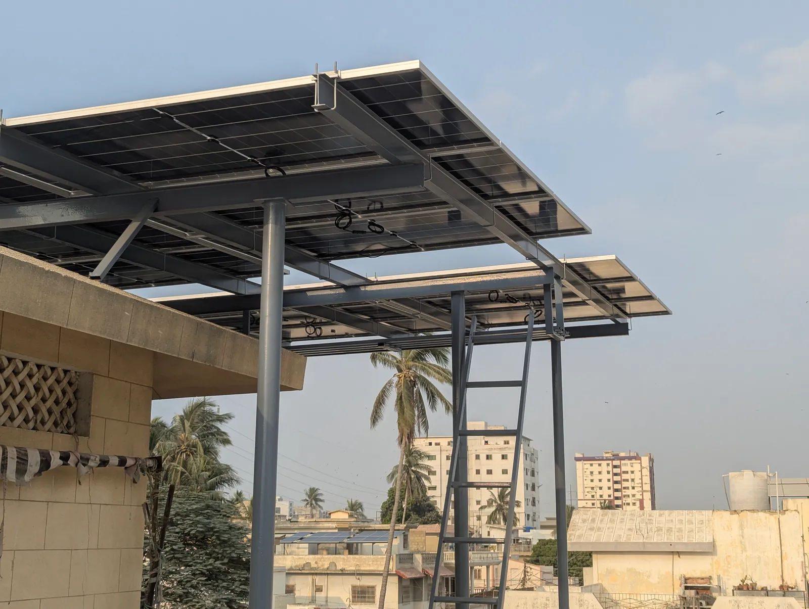 Elevated canopy solar array on a steel frame by APC Solar in Karachi