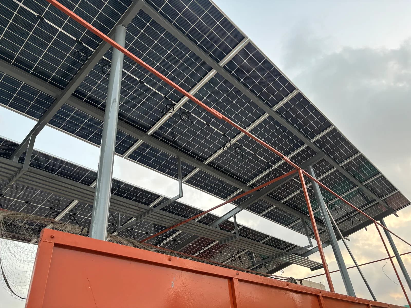 Elevated solar array clearing rooftop obstructions, by APC Solar in Karachi