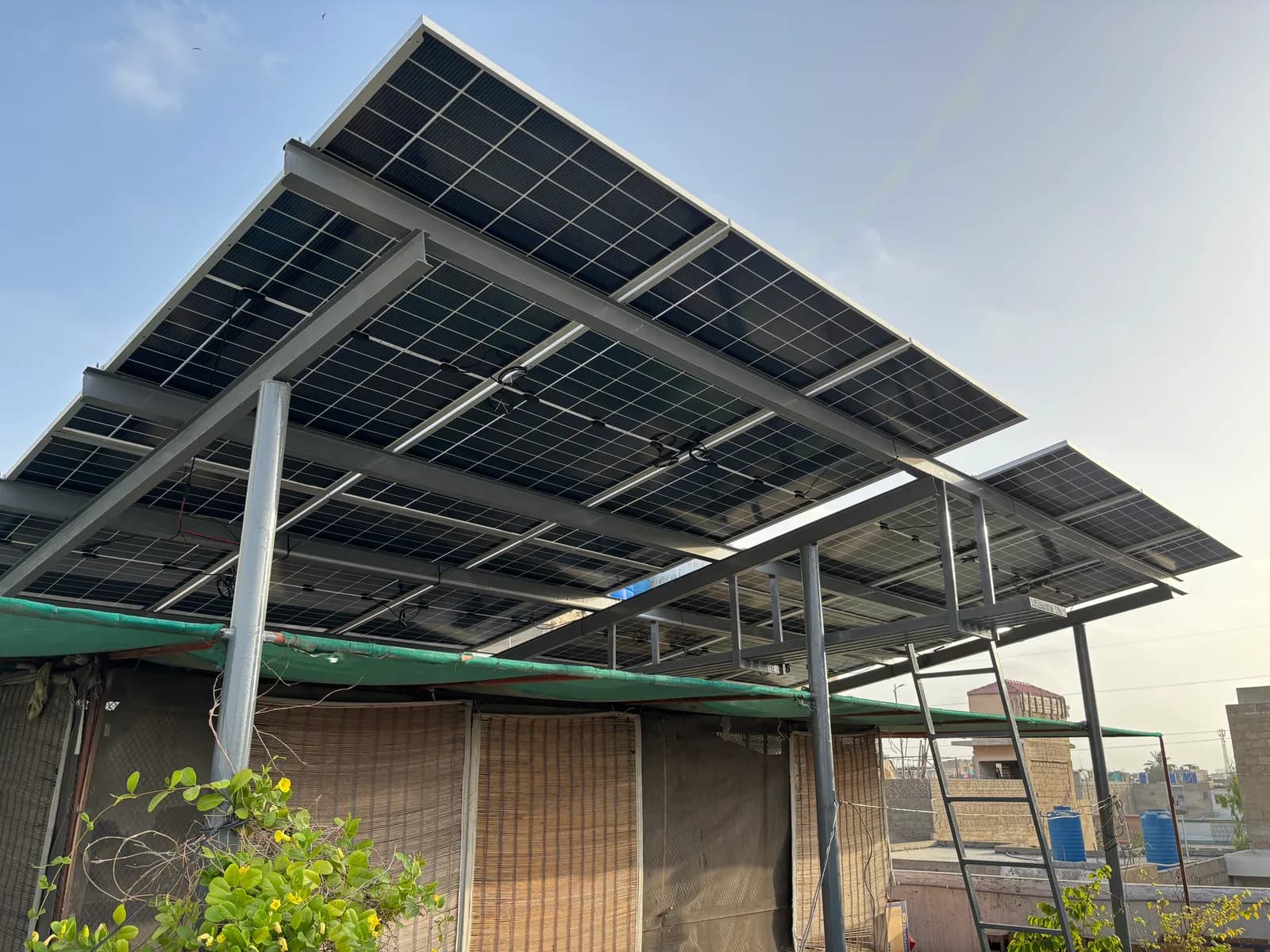 Twin-row elevated solar array on a steel frame by APC Solar in Karachi
