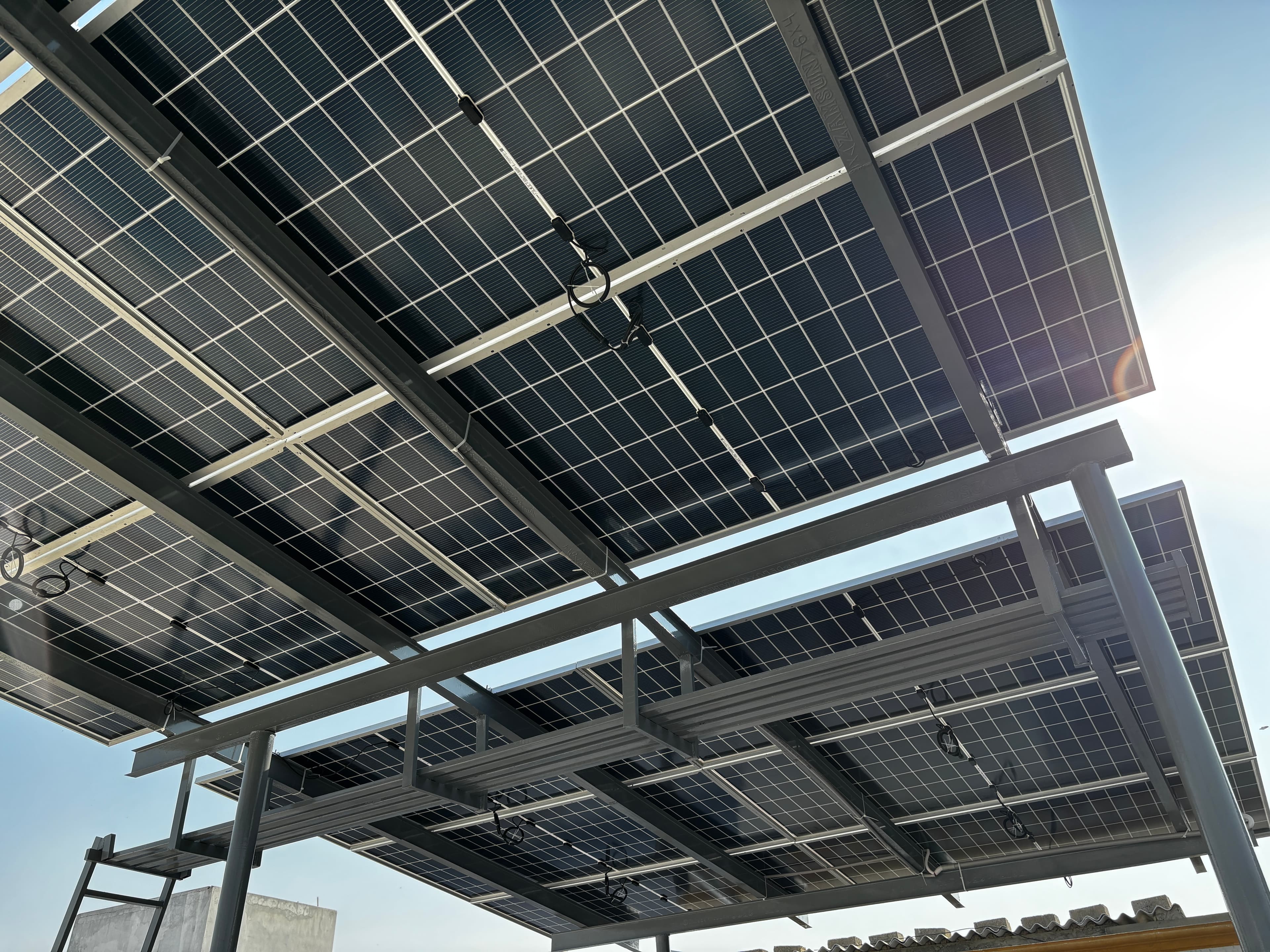 Tier-1 monocrystalline solar panels against the Karachi sky