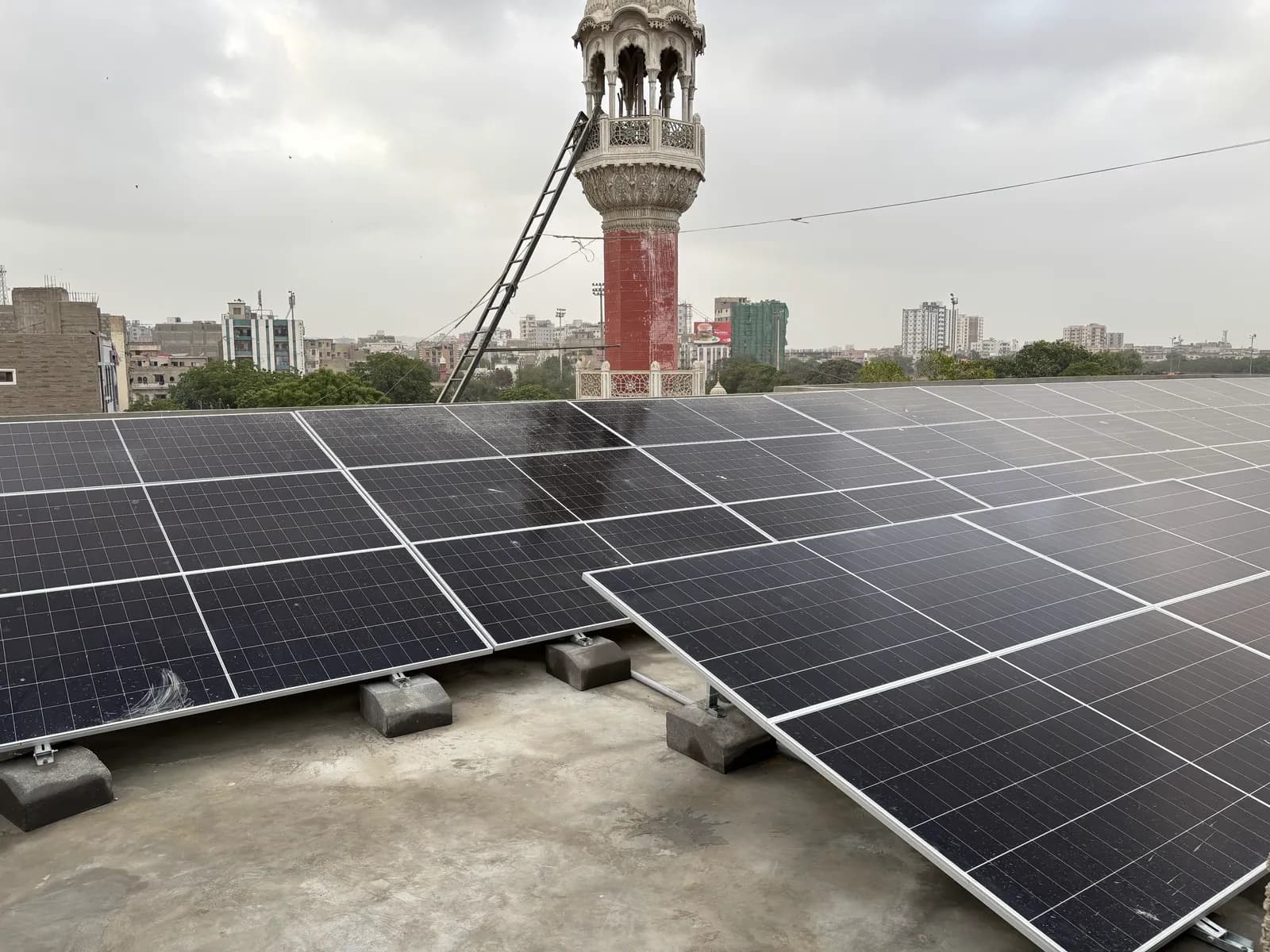 Ballasted flush rooftop solar array installed by APC Solar in Karachi with no roof penetrations